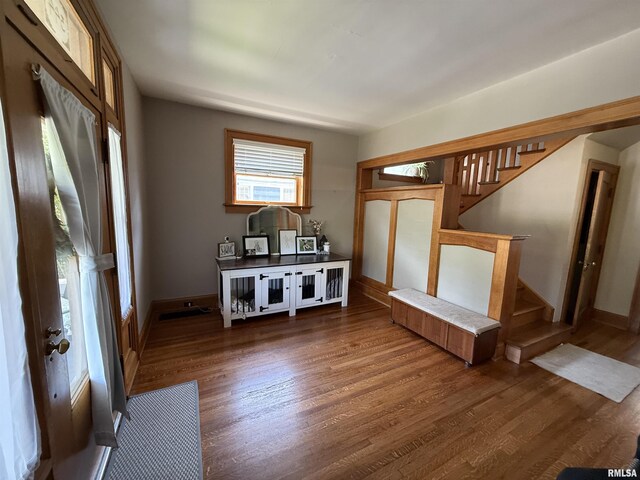 344 S 24th St, Quincy, IL 62301 - entrance foyer featuring wood finished floors, stairway, and baseboards