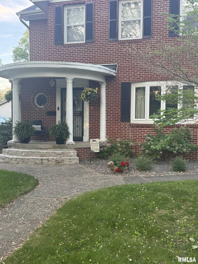 409 N Broadway St, Havana, IL 62644 - view of front of home with a porch and brick siding