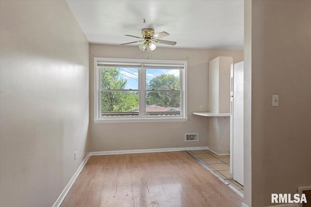 2309 W Lawrence Ave, Springfield, IL 62704 - spare room with ceiling fan, hardwood / wood-style floors, and baseboards