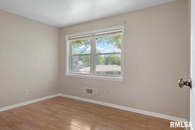 2309 W Lawrence Ave, Springfield, IL 62704 - spare room featuring light wood-style flooring and baseboards