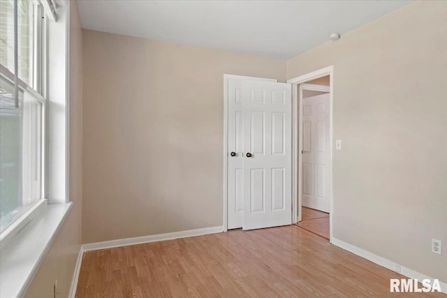 2309 W Lawrence Ave, Springfield, IL 62704 - spare room with light wood finished floors, baseboards, and a smoke detector