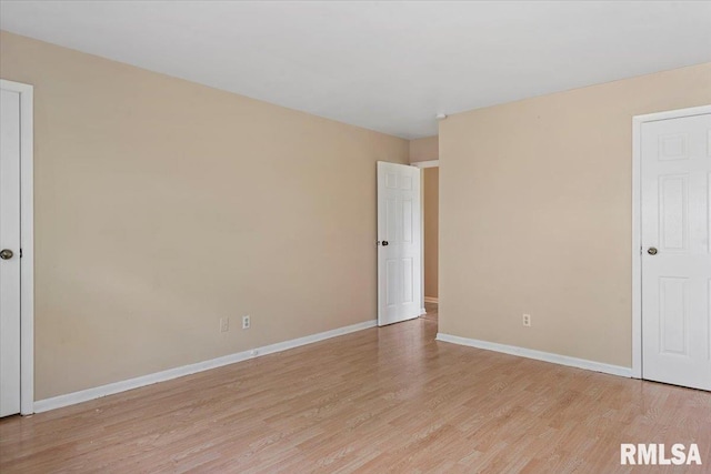 2309 W Lawrence Ave, Springfield, IL 62704 - unfurnished bedroom with light wood finished floors and baseboards