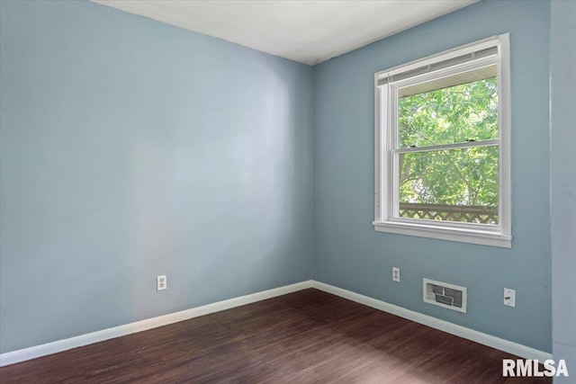 2309 W Lawrence Ave, Springfield, IL 62704 - empty room with dark wood-style flooring and baseboards