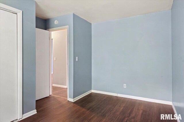 2309 W Lawrence Ave, Springfield, IL 62704 - unfurnished bedroom featuring wood finished floors and baseboards