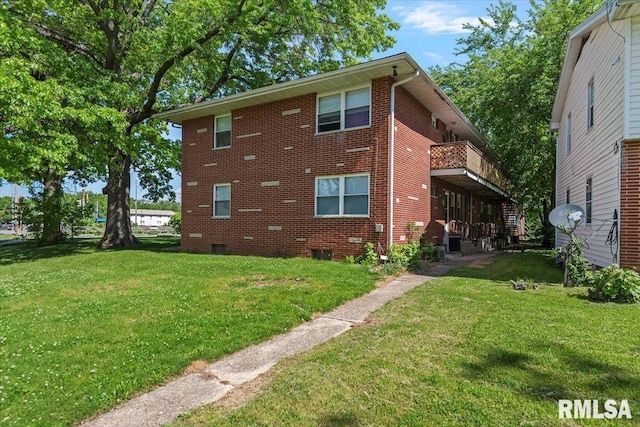 2309 W Lawrence Ave, Springfield, IL 62704 - view of home's exterior with a yard, brick siding, and a balcony