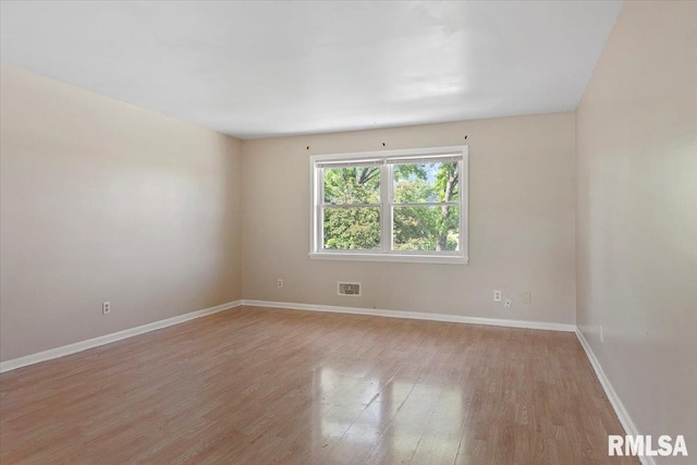 2309 W Lawrence Ave, Springfield, IL 62704 - unfurnished room with light wood-style floors and baseboards