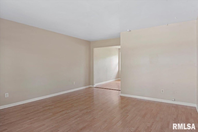 2309 W Lawrence Ave, Springfield, IL 62704 - spare room featuring light wood-style floors and baseboards