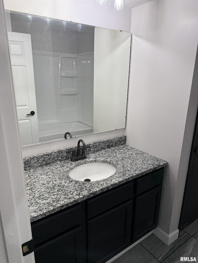 1352 N Lawrence Ave, Taylorville, IL 62568 - bathroom featuring vanity, tile patterned flooring, and bathing tub / shower combination