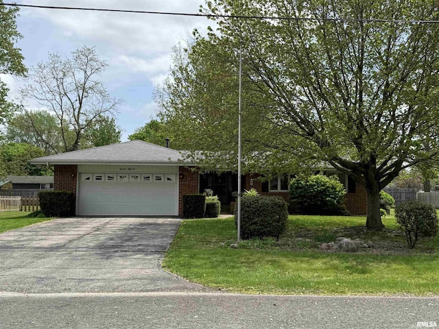 1352 N Lawrence Ave, Taylorville, IL 62568 - view of front of property with driveway, an attached garage, and brick siding