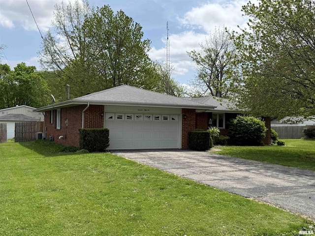 1352 N Lawrence Ave, Taylorville, IL 62568 - ranch-style house featuring brick siding, asphalt driveway, an attached garage, and cooling unit