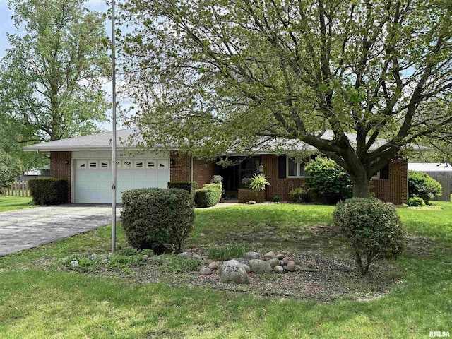 1352 N Lawrence Ave, Taylorville, IL 62568 - view of front of house featuring brick siding, an attached garage, and driveway