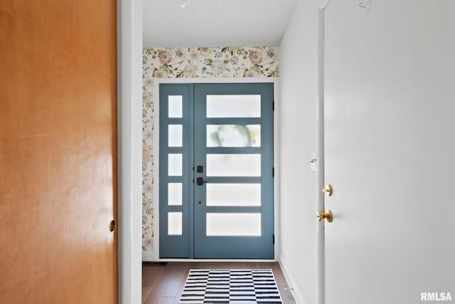 704 Rickard Rd, Springfield, IL 62704 - foyer entrance with wallpapered walls, an accent wall, healthy amount of natural light, baseboards, and wood finished floors