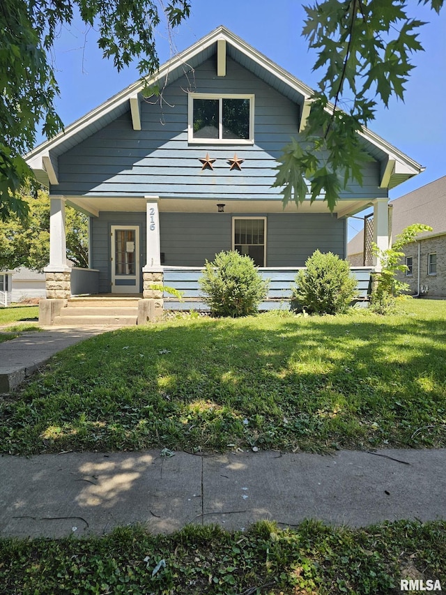 216 W Church St, Palmyra, MO 63461 - view of front of house with covered porch and a front yard