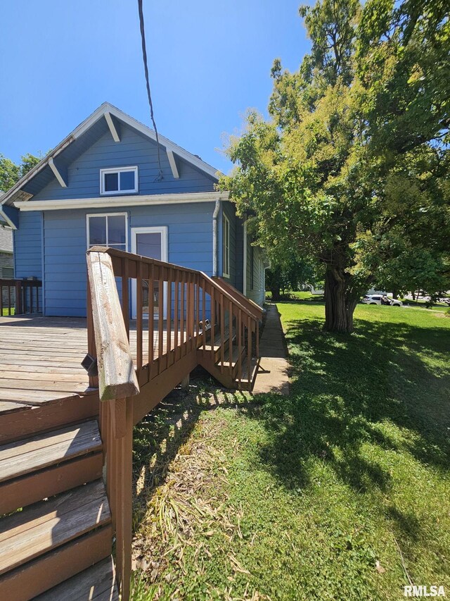 216 W Church St, Palmyra, MO 63461 - rear view of property with a yard and a wooden deck