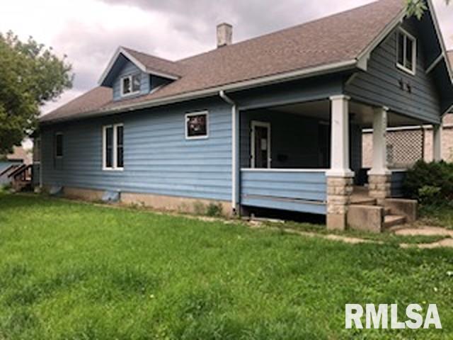 216 W Church St, Palmyra, MO 63461 - view of side of property featuring a yard