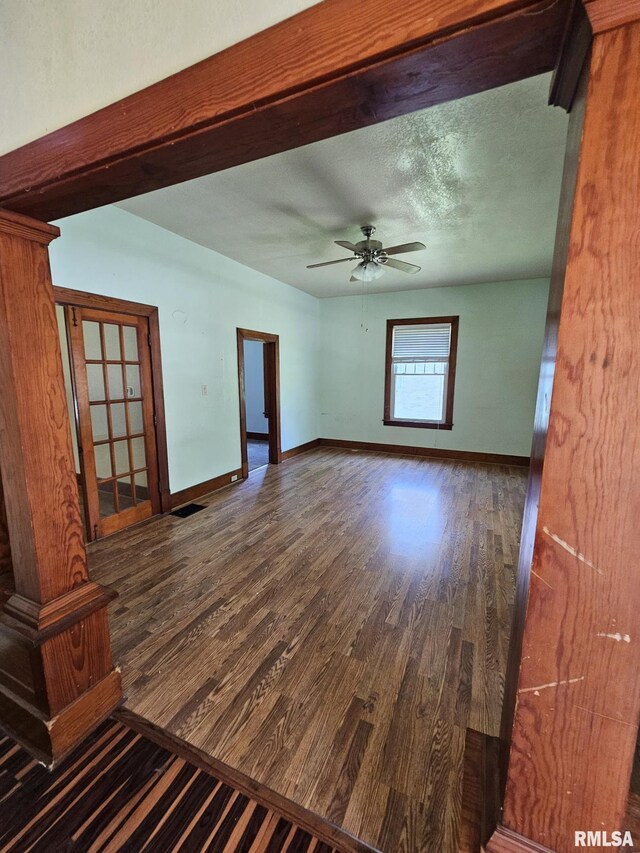 216 W Church St, Palmyra, MO 63461 - empty room with wood finished floors and ceiling fan