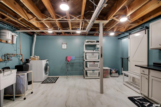 130 S State St, Mendon, IL 62351 - finished below grade area with a barn door and washing machine and dryer