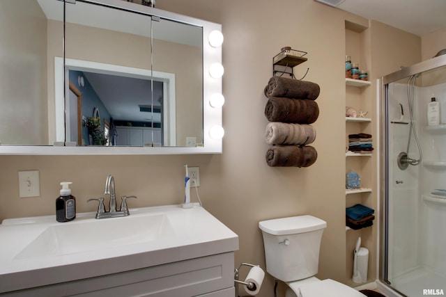 130 S State St, Mendon, IL 62351 - bathroom with a shower stall, vanity, and toilet
