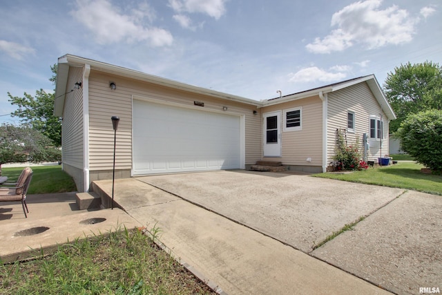 130 S State St, Mendon, IL 62351 - view of front facade featuring entry steps, driveway, a garage, and a front lawn