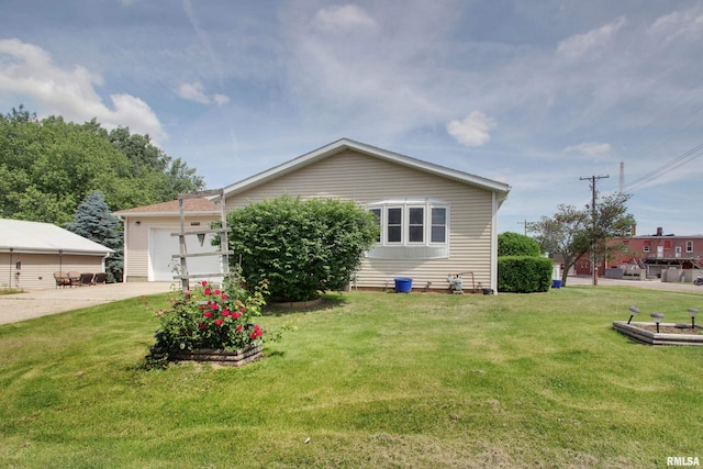 130 S State St, Mendon, IL 62351 - view of front of house with concrete driveway, an attached garage, and a front yard