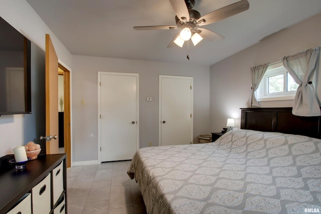 130 S State St, Mendon, IL 62351 - bedroom featuring light tile patterned flooring, ceiling fan, and baseboards