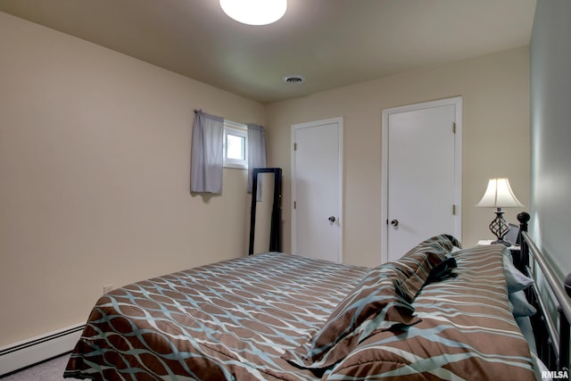 130 S State St, Mendon, IL 62351 - bedroom featuring a baseboard radiator and carpet floors