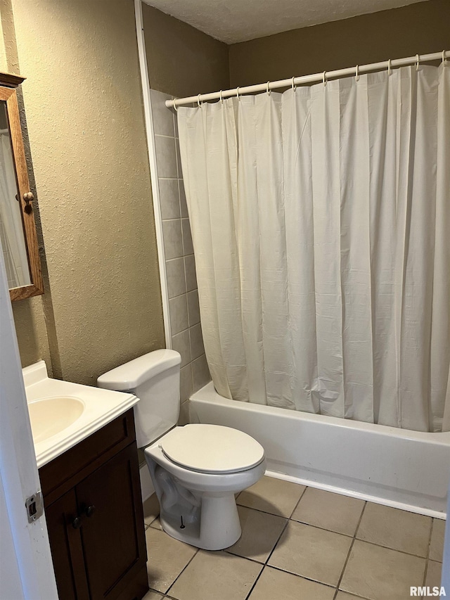 626 W Edwards St, Springfield, IL 62704 - bathroom featuring vanity, toilet, shower / bath combo, a textured wall, and tile patterned floors