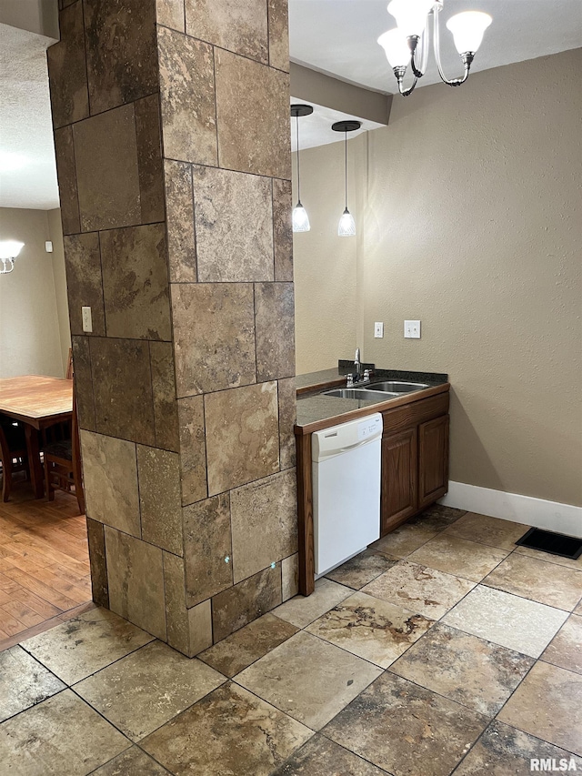 626 W Edwards St, Springfield, IL 62704 - bathroom with a chandelier, vanity, baseboards, and stone tile floors
