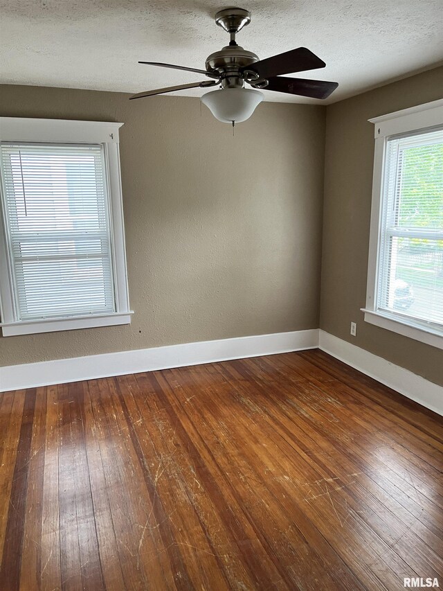 626 W Edwards St, Springfield, IL 62704 - empty room with a ceiling fan, hardwood / wood-style flooring, and baseboards