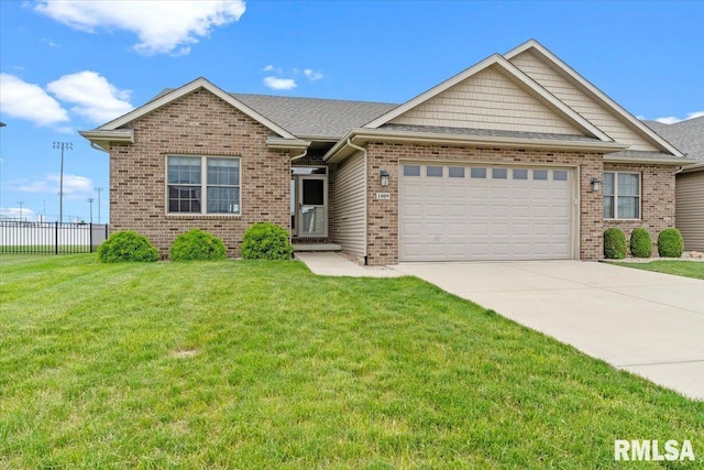1809 Spartan Dr, Chatham, IL 62629 - view of front of property featuring an attached garage, concrete driveway, and brick siding