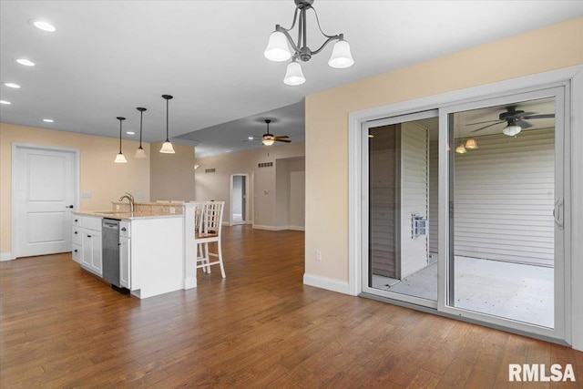 1809 Spartan Dr, Chatham, IL 62629 - kitchen with ceiling fan, dishwasher, a breakfast bar area, white cabinets, and dark wood-style flooring