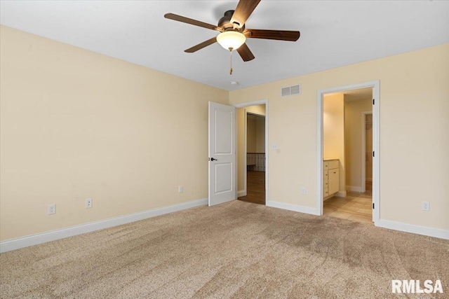 1809 Spartan Dr, Chatham, IL 62629 - unfurnished bedroom with light colored carpet, baseboards, and ensuite bathroom