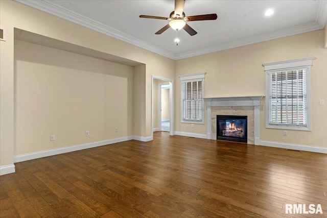 1809 Spartan Dr, Chatham, IL 62629 - unfurnished living room with ceiling fan, wood finished floors, crown molding, a tiled fireplace, and baseboards