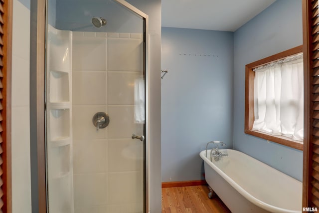 2911 Hampshire St, Quincy, IL 62301 - full bathroom with a stall shower, wood finished floors, and a freestanding tub
