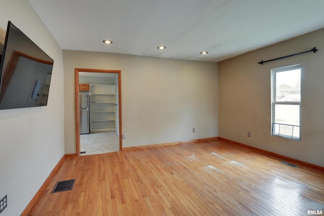 2911 Hampshire St, Quincy, IL 62301 - empty room with light wood-type flooring, recessed lighting, and baseboards