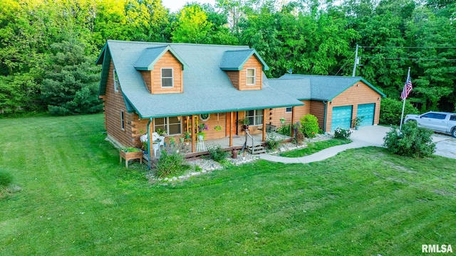 2061 N 425th St, Vandalia, IL 62471 - view of front of home with a porch, a front yard, a garage, and a wooded view
