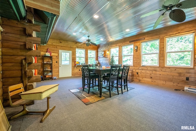 2061 N 425th St, Vandalia, IL 62471 - dining area with a ceiling fan, carpet flooring, wood walls, and a baseboard heating unit