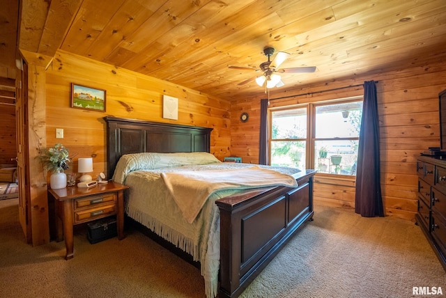 2061 N 425th St, Vandalia, IL 62471 - carpeted bedroom with wood walls, wooden ceiling, and a ceiling fan