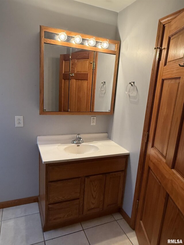 515 Morgan St, Chapin, IL 62628 - bathroom with vanity, baseboards, and tile patterned flooring