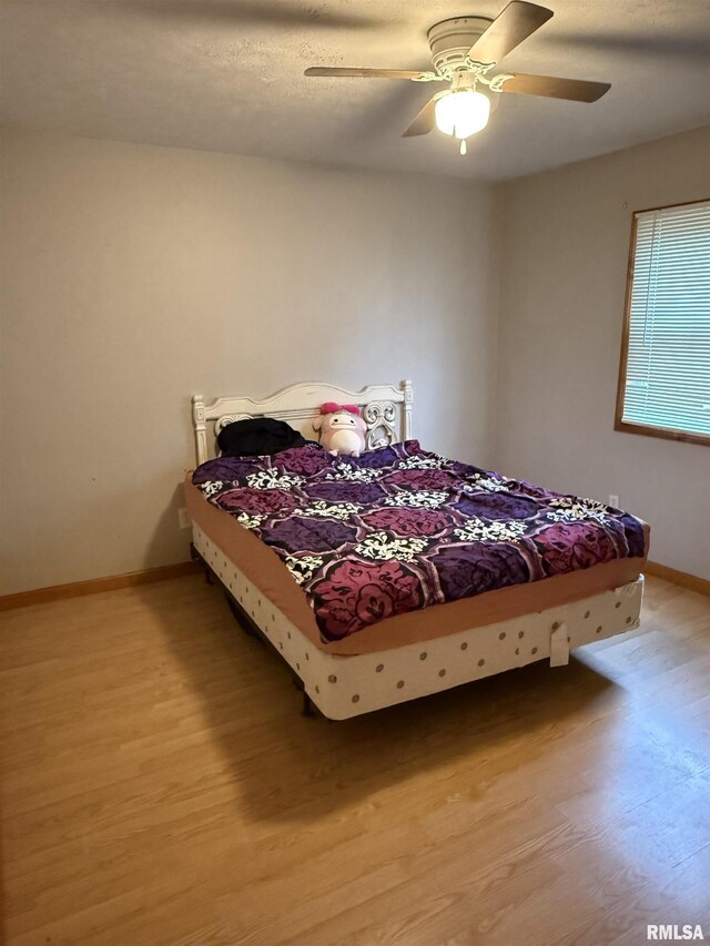 515 Morgan St, Chapin, IL 62628 - bedroom featuring light wood finished floors, baseboards, and ceiling fan