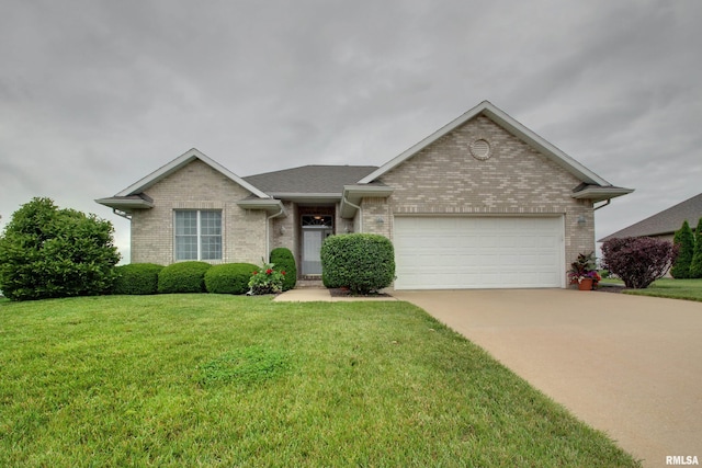 2723 Ridgecrest Dr, Quincy, IL 62305 - view of front of property with brick siding, a garage, driveway, and a front lawn