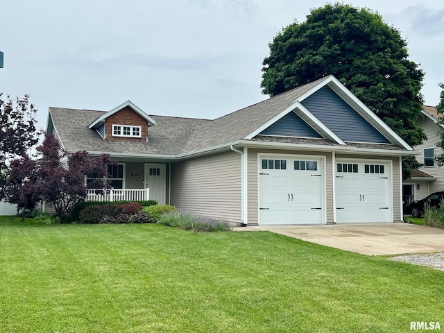 409 W Main St, Williamsville, IL 62693 - view of front of property featuring a front yard, covered porch, a shingled roof, a garage, and concrete driveway