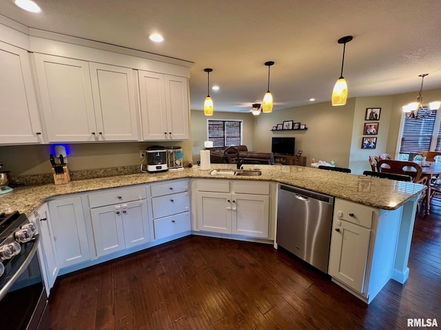 409 W Main St, Williamsville, IL 62693 - kitchen featuring appliances with stainless steel finishes, a peninsula, dark wood-type flooring, white cabinetry, and recessed lighting