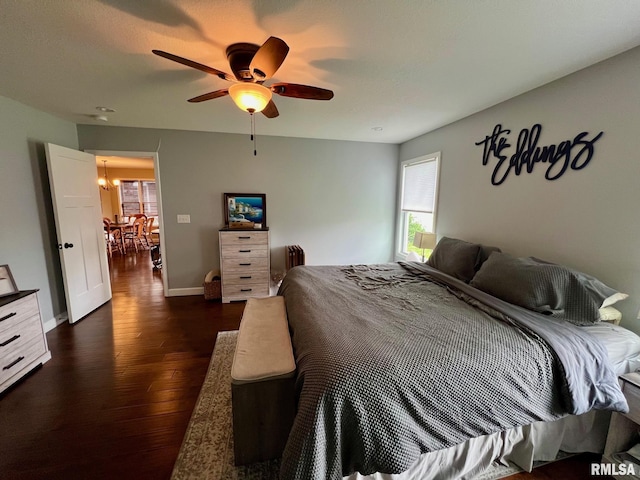 409 W Main St, Williamsville, IL 62693 - bedroom featuring dark wood-style floors and ceiling fan