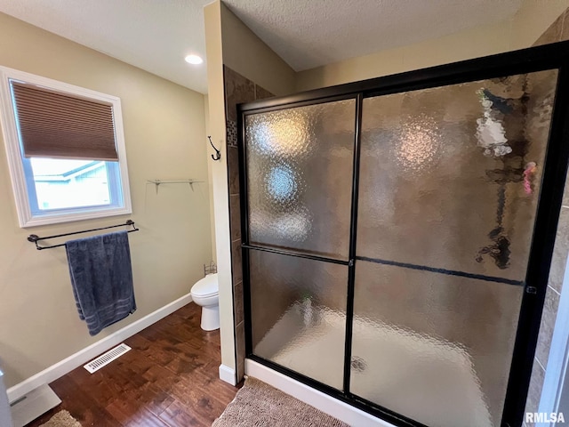 409 W Main St, Williamsville, IL 62693 - full bath with wood finished floors, a stall shower, and recessed lighting
