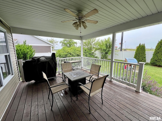 409 W Main St, Williamsville, IL 62693 - wooden terrace featuring ceiling fan, outdoor dining area, and a grill