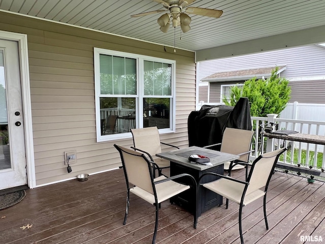 409 W Main St, Williamsville, IL 62693 - wooden deck featuring outdoor dining area, a ceiling fan, and a grill