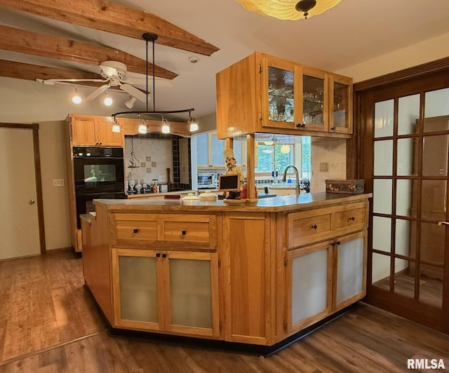 131 E Willard St, Wataga, IL 61488 - kitchen with ceiling fan, dark wood-type flooring, beam ceiling, glass insert cabinets, and decorative light fixtures