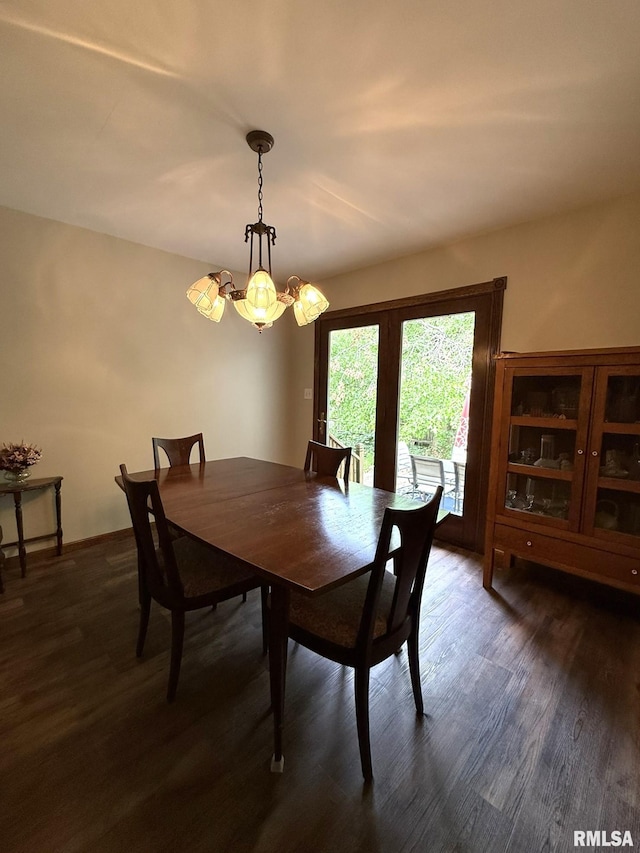 131 E Willard St, Wataga, IL 61488 - dining room featuring dark wood finished floors and a chandelier