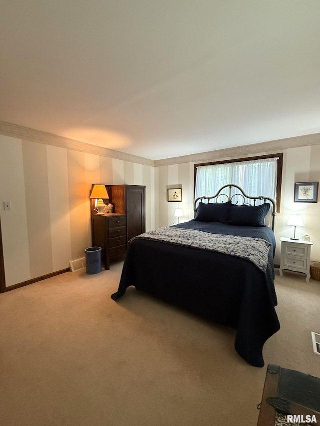 131 E Willard St, Wataga, IL 61488 - bedroom featuring light carpet and baseboards
